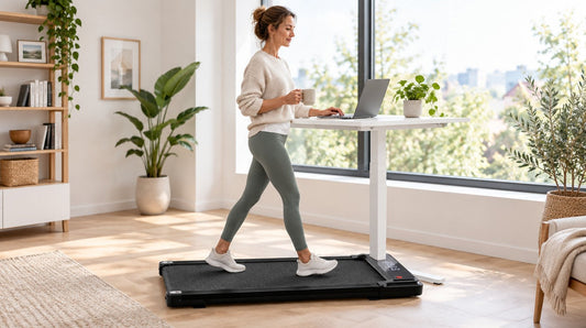 Person walking slowly on a flat walking pad at a standing desk in a bright home office
