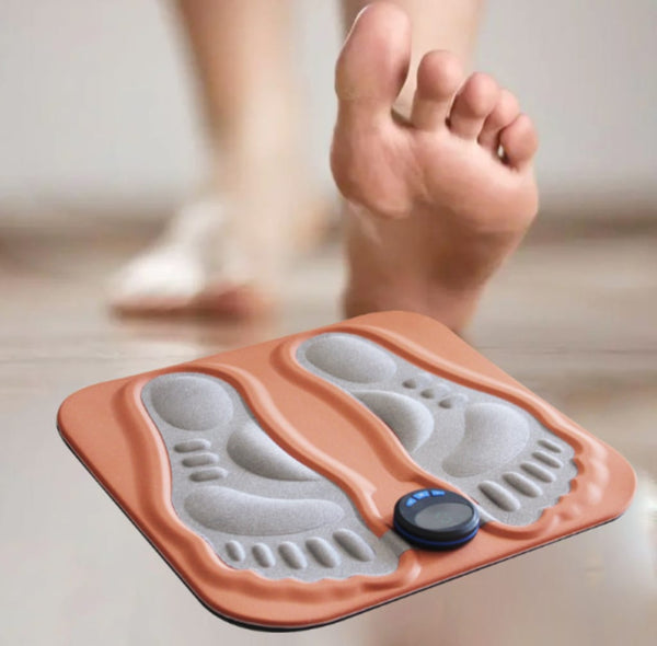 Stepping onto the EMS foot massager mat